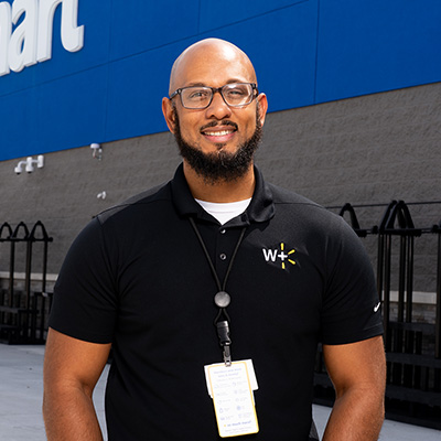 Store Manager Junius Williams stands outside of his new Walmart supercenter in Cypress, Texas.